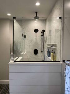 walk in shower with black shower fixtures