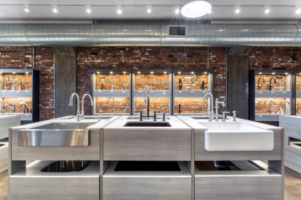 Kitchen sinks, kitchen sink faucets, kitchen sink displays, showroom, kitchen sink showroom, brick wall