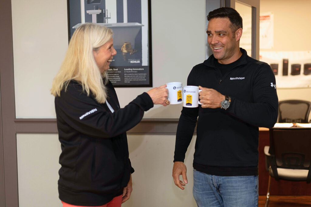 teammates cheering with coffee cups