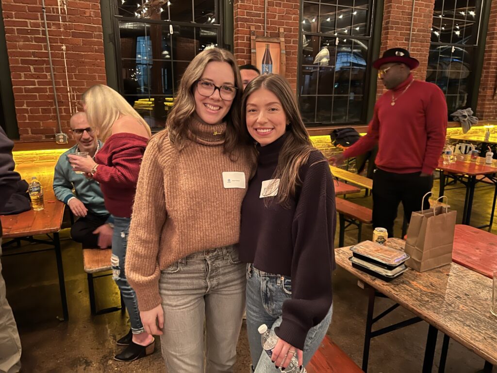 women posing at teammate holiday party