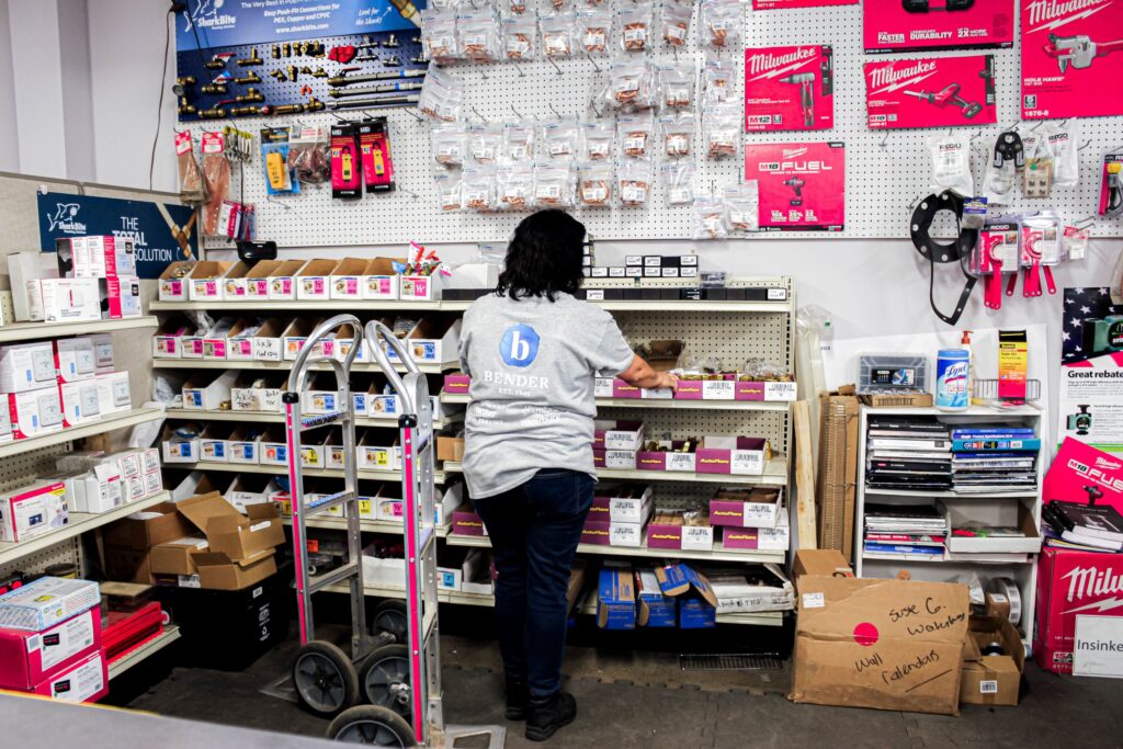 women stocking shelves