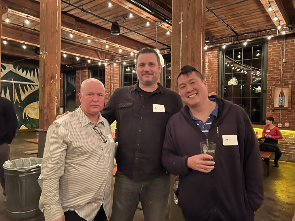 men posing at holiday party